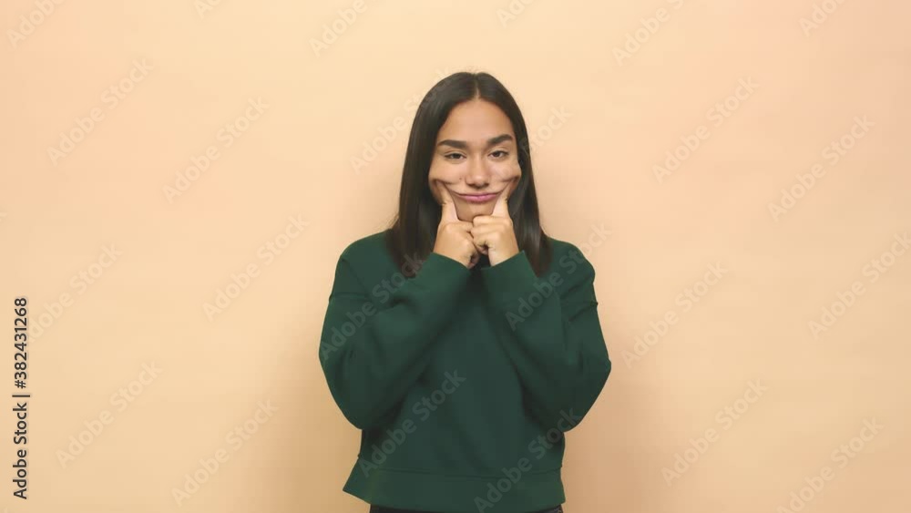 Young mixed race indian woman doubting between two options Young mixed race indian woman doubting between two options