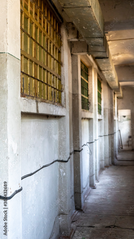 Light Coming in Through Prison Cell Bars Window. Empty Jail Cells. Prison Interior. Concept of Limiting Freedom.