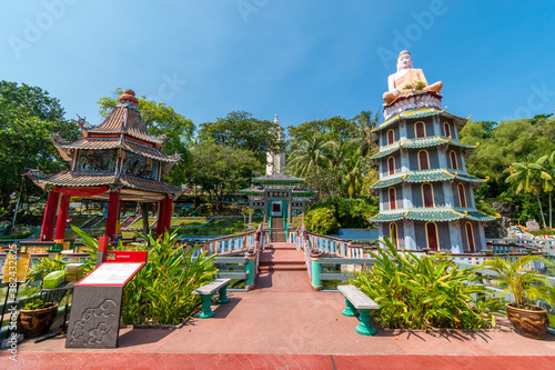 Chinese Pagoda and Pavilion by the Lake at Haw Par Villa Theme Park. This park has statues and dioramas scenes from Chinese mythology  folklore  legends  and history.