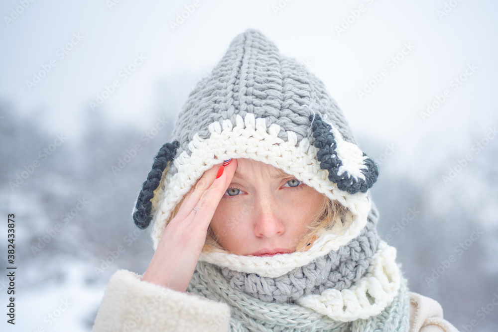 Allergy winter season. Woman having headache on snow background. Allergy winter season. Woman having headache on snow background.