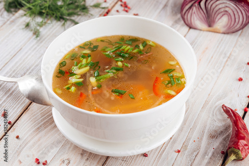 Homemade vegetable soup with green onions
