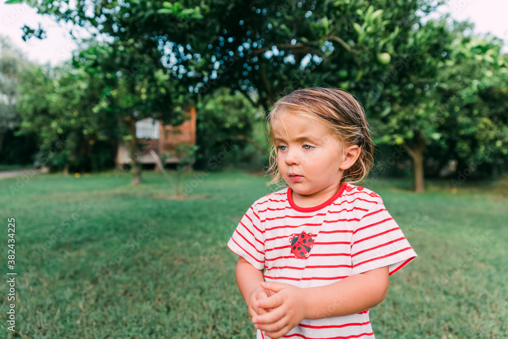 Toddler girl portrait in garden
