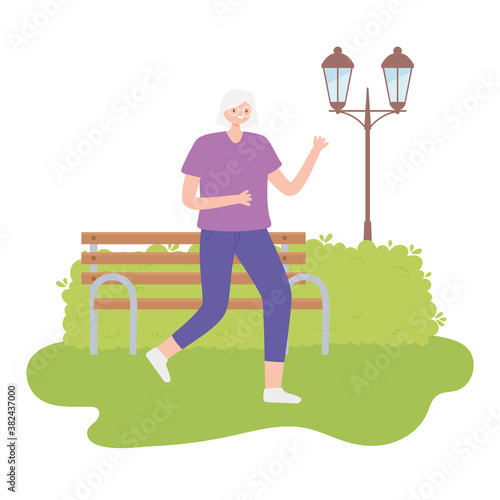 activity seniors, mature woman with sportswear walking in the park