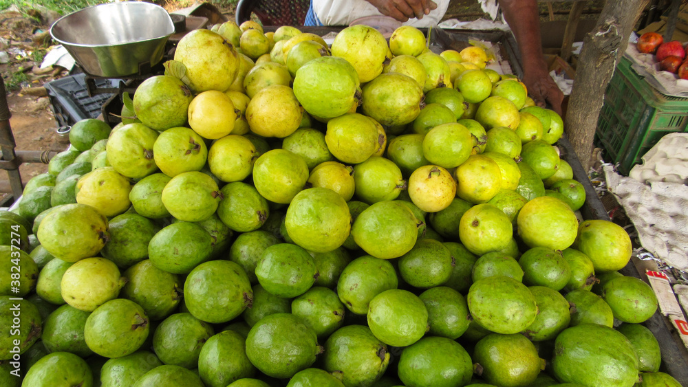 green guavas in a market