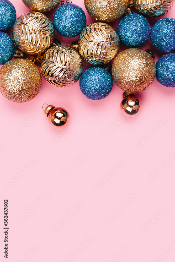 Christmas composition. Gold blue decorations on pastel pink background. Christmas, winter, new year concept. Flat lay, top view, copy space. Christmas composition. Gold blue decorations on pastel pink background. Christmas, winter, new year concept. Flat lay, top view, copy space.