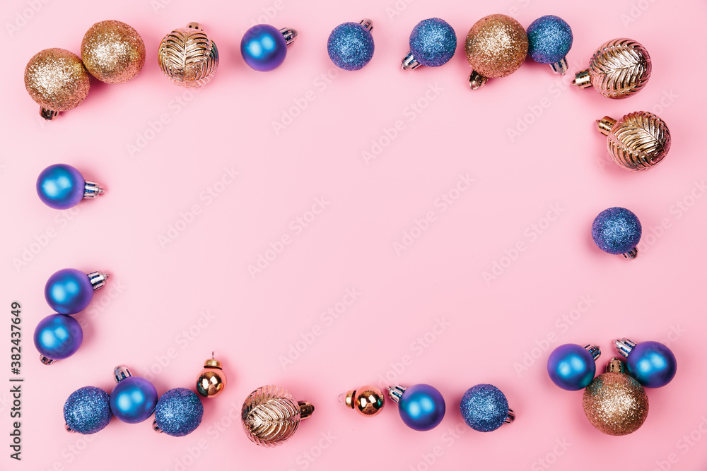 Christmas composition. Gold blue decorations on pastel pink background. Christmas, winter, new year concept. Flat lay, top view, copy space. Christmas composition. Gold blue decorations on pastel pink background. Christmas, winter, new year concept. Flat lay, top view, copy space.