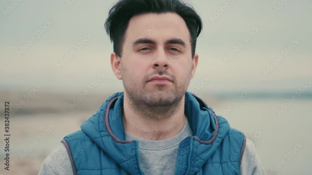 Portrait of a man with a beard outdoors. Stylish confident young man looking at the camera. Portrait of a man with a beard outdoors. Stylish confident young man looking at the camera.