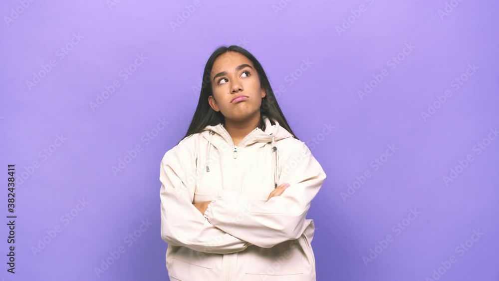 Young mixed race indian woman tired of a repetitive task Young mixed race indian woman tired of a repetitive task