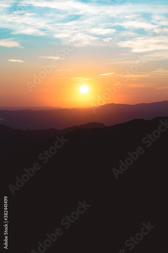 Wallpaper Mural Sunset between mountains with clouds and colorful sky Torontodigital.ca