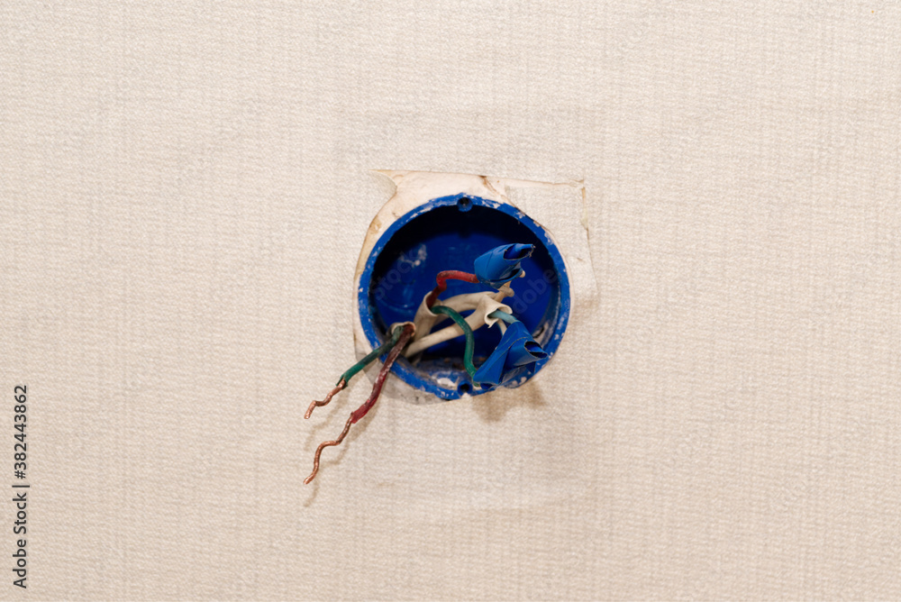 wires of a disassembled socket at home, home electrician repair, copy space wires of a disassembled socket at home, home electrician repair, copy space