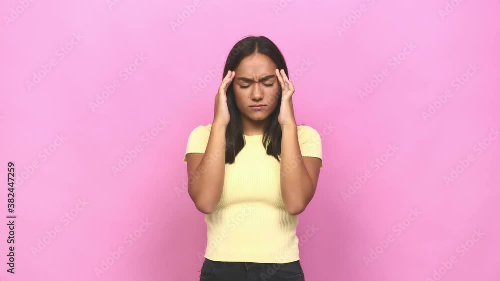 Young mixed race indian woman touching temples and having headache Young mixed race indian woman touching temples and having headache