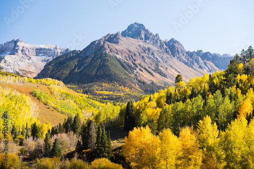 Mount Sneffles surrounded by fall foliage. 