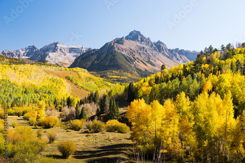 Mount Sneffles surrounded by fall foliage.  photo