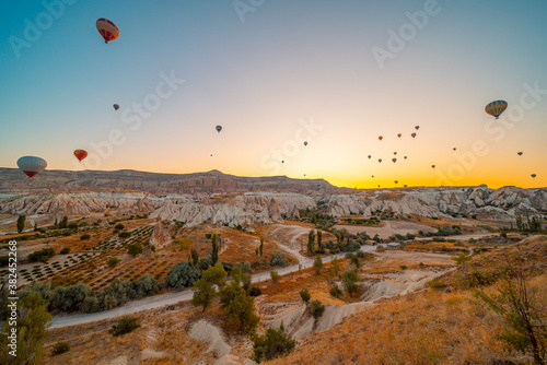 Kapadokya Beautiful vibrant colorful balloons in sunrise light in Cappadocia Turkey Goreme