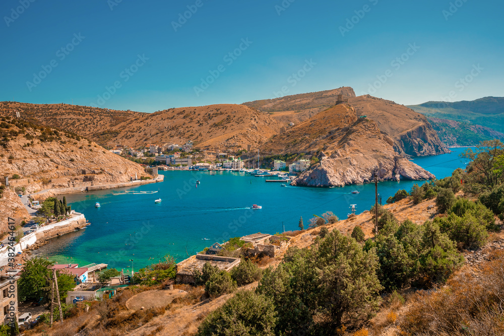 Obraz premium Picturesque panoramic view of Balaklava bay with yachts and green hills. Sevastopol, Crimea.