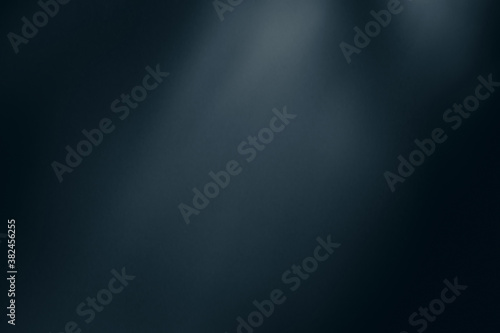 Blurred abstract colored dark blue light spots background.