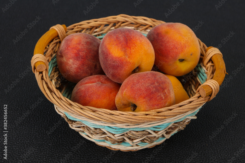 Peach heap in the wooden basket Peach heap in the wooden basket