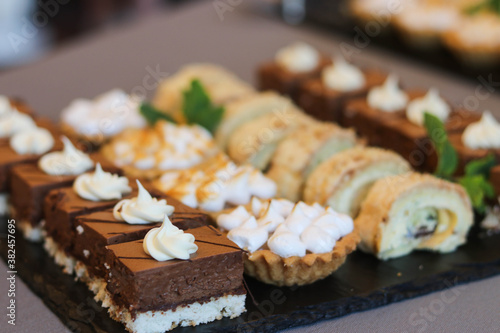 sweet pastries for candy bar in assortment on the table