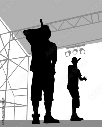 Young man with a microphone reads a rap. Stylized image on theme of hip hop