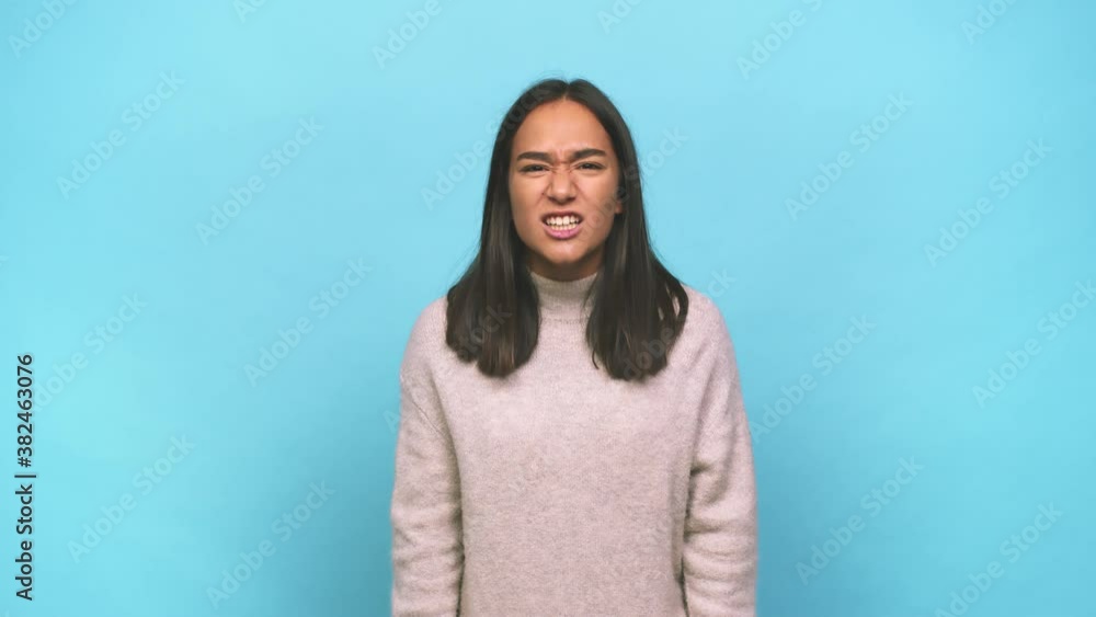 Young mixed race indian woman screaming very angry and aggressive Young mixed race indian woman screaming very angry and aggressive