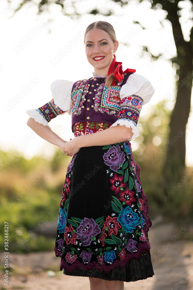 Young beautiful slovak woman in traditional costume. Slovak folklore ...