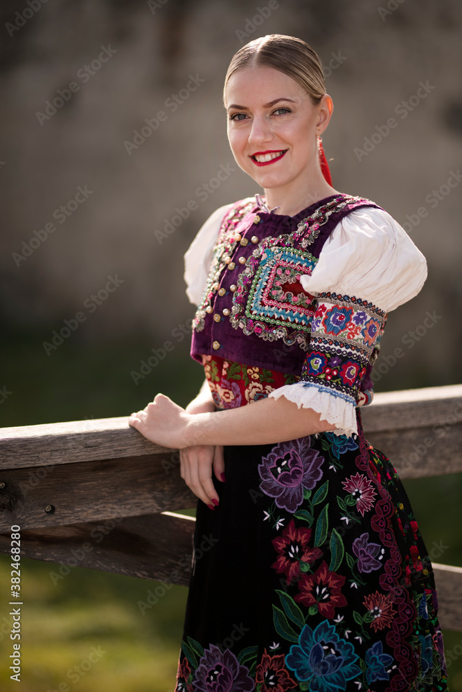 Young beautiful slovak woman in traditional costume. Slovak folklore.