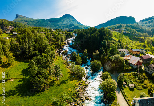 View of the river Geirangerelvi and the waterfall Storfossen in Geiranger, Norway. photo