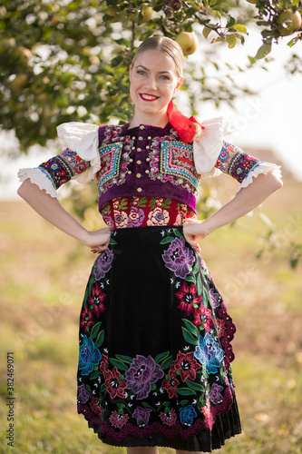 Young beautiful slovak woman in traditional costume. Slovak folklore.