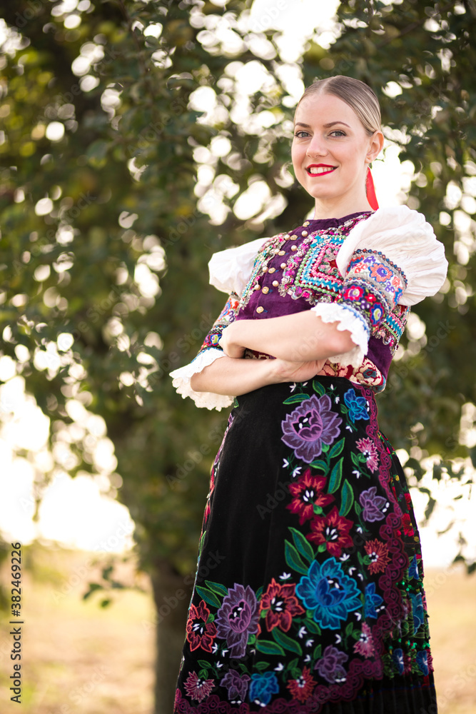 Young beautiful slovak woman in traditional costume. Slovak folklore.