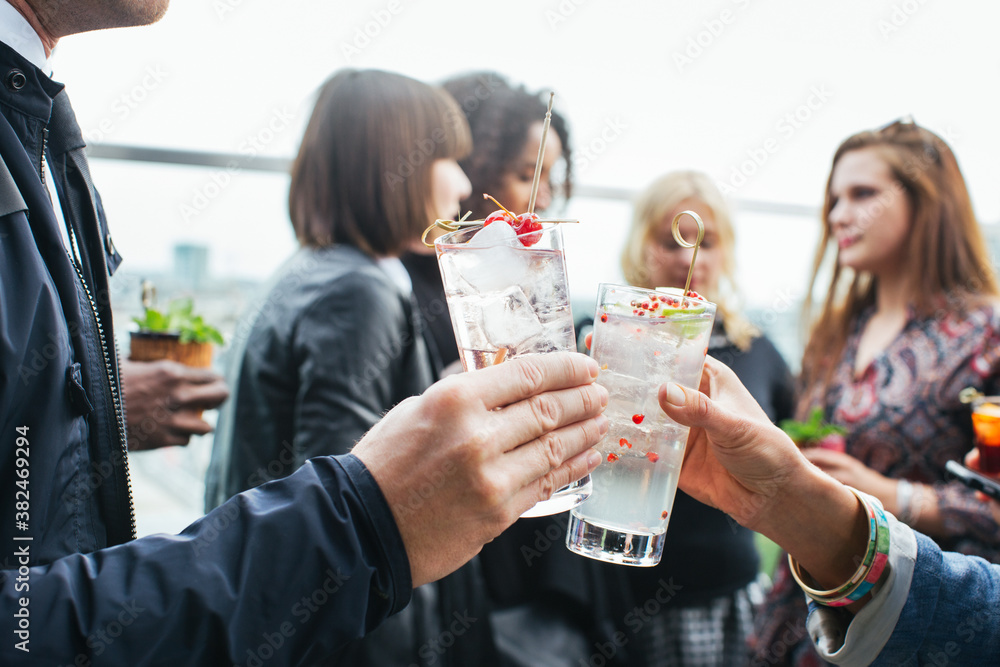 Drinks With Friends - Close Up of Man and Woman Clinking Cocktail Glasses on Rooftop Bar Drinks With Friends - Close Up of Man and Woman Clinking Cocktail Glasses on Rooftop Bar