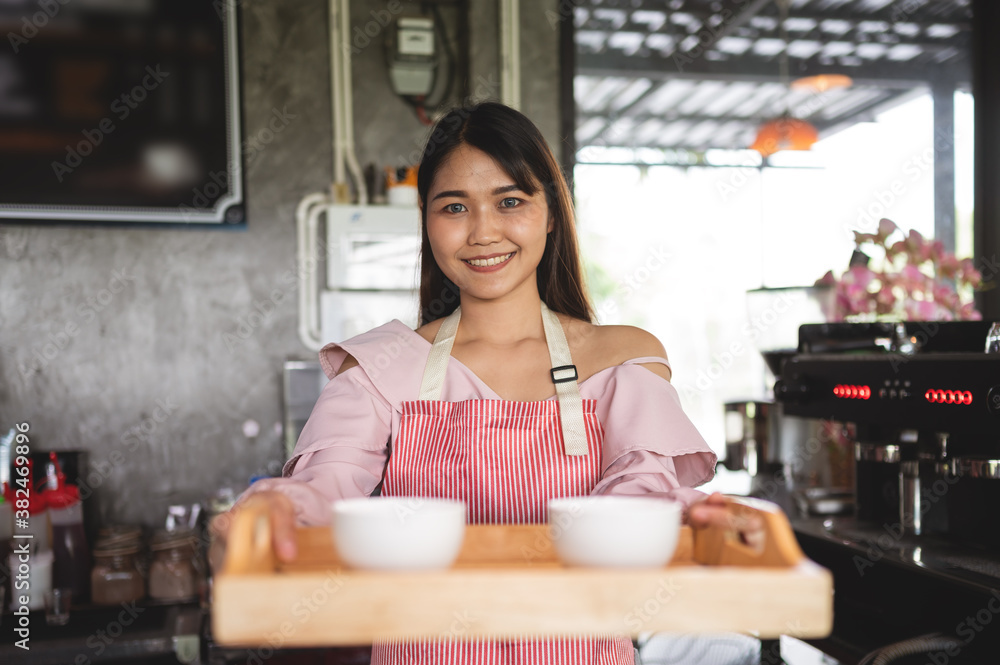 Startup new business concept. Portrait of Asian female working in her coffee shop Startup new business concept. Portrait of Asian female working in her coffee shop