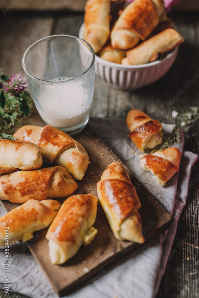 Baked rolls and a glass of milk Baked rolls and a glass of milk