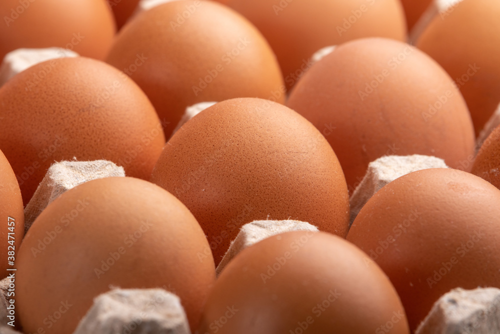 closeup of brown chicken eggs in a carton closeup of brown chicken eggs in a carton