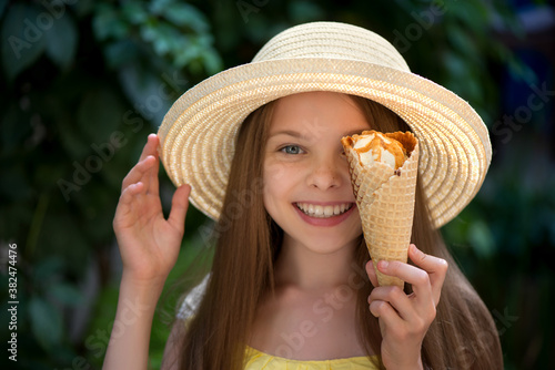 Smiling little girl with ice cream.