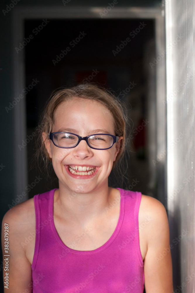 Smiling girl in doorway Smiling girl in doorway