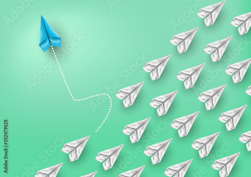 Group of paper airplanes flying.Paper plant in one direction and one paper plant pointing in different way on background.Unique,out standing.Vector concept inspiration and think different concept.