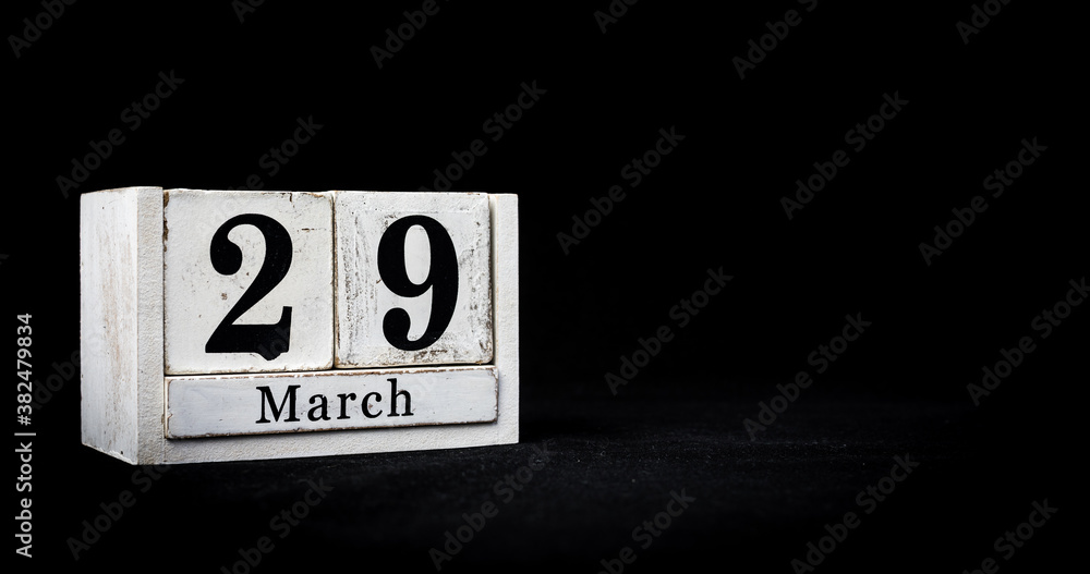 March 29th, Twenty-ninth of March, Day 29 of month March - white calendar blocks on black textured background with empty space for text. March 29th, Twenty-ninth of March, Day 29 of month March - white calendar blocks on black textured background with empty space for text.
