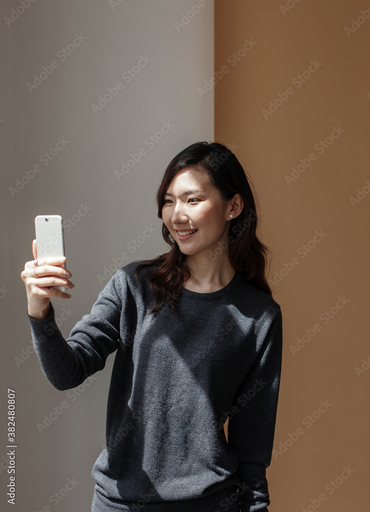 Young woman taking a selfie. Young woman taking a selfie.