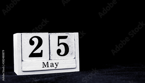 May 25th, Twenty-fifth of May, Day 25 of month May - vintage wooden white calendar blocks on black background with empty space for text