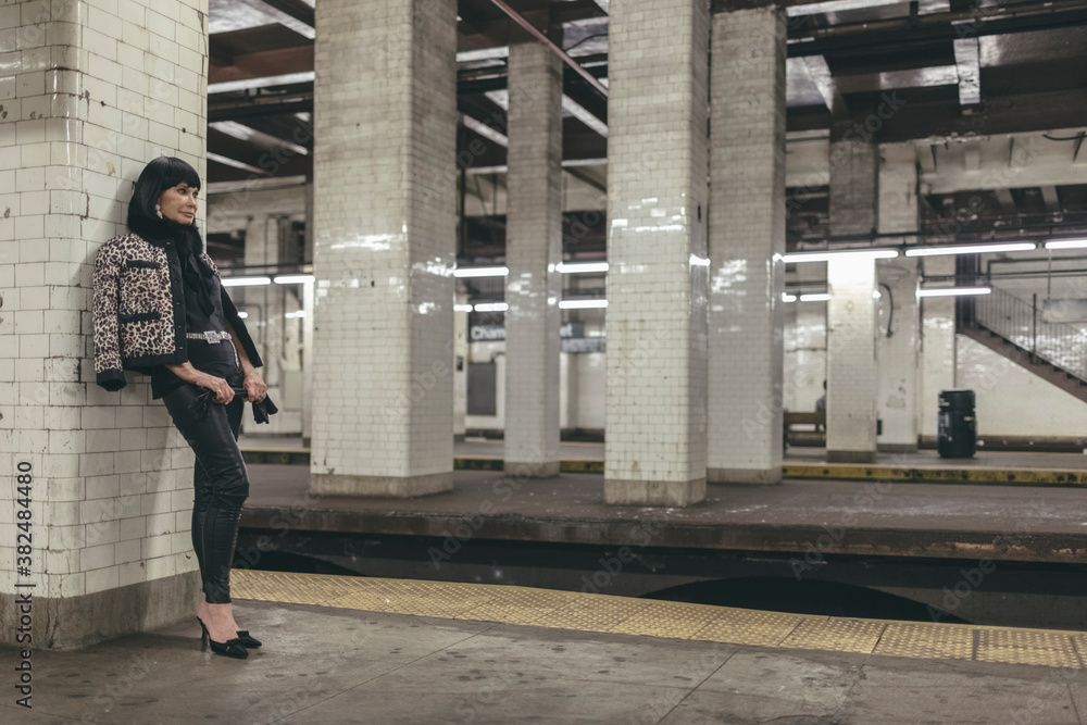 Senior Caucasian Woman Fashionista in New York Subway Station Platform Senior Caucasian Woman Fashionista in New York Subway Station Platform
