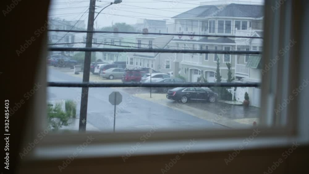 Buildings and street on rainy day seen through window Buildings and street on rainy day seen through window