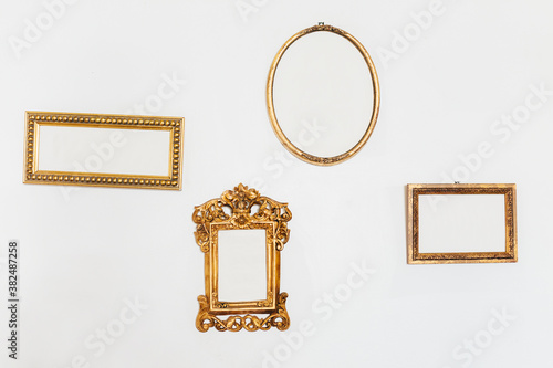 Empty Golden Frames on a White Wall photo