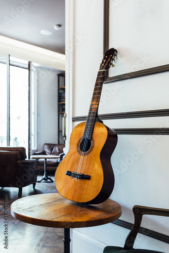 Spanish Guitar Leaning on a Table photo