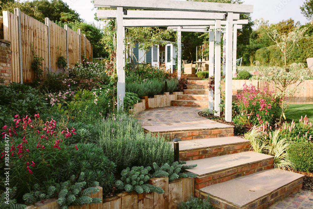 Pergolas and steps in a family garden. Pergolas and steps in a family garden.