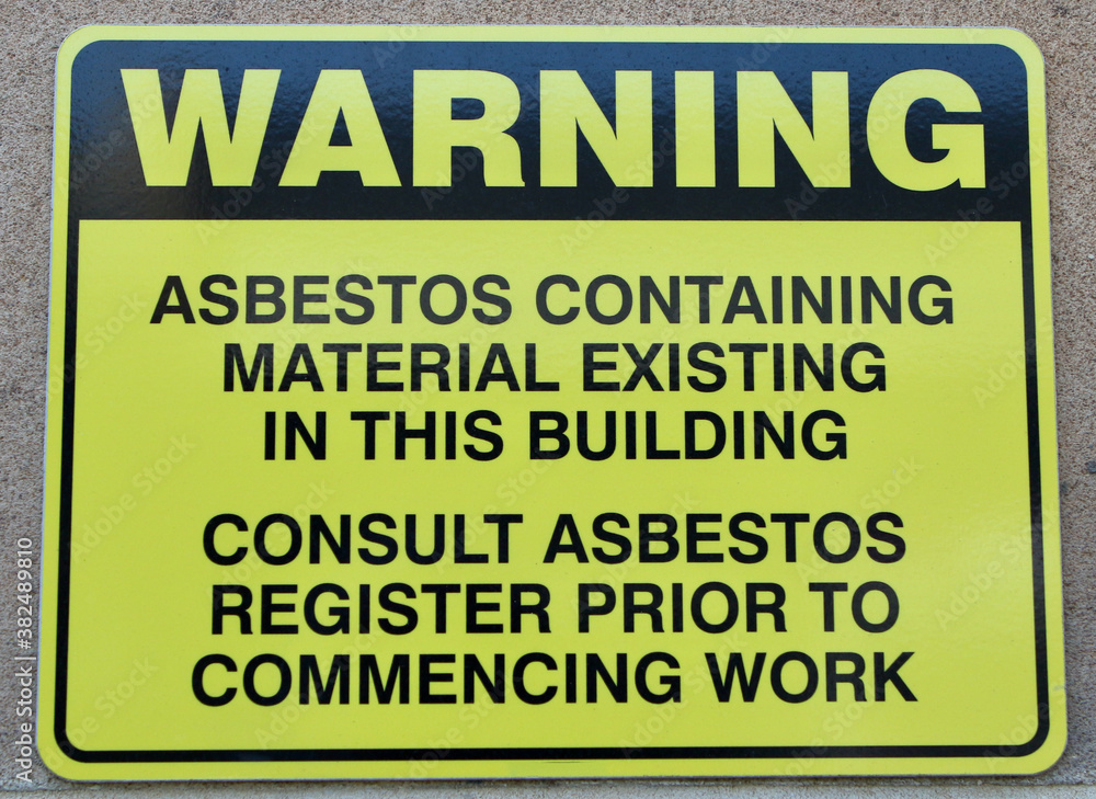 Warning about asbestos existing in the building signage. Warning about asbestos existing in the building signage.