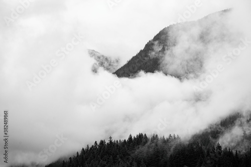 Rather Aggressive Clouds Shrouding Mountain photo