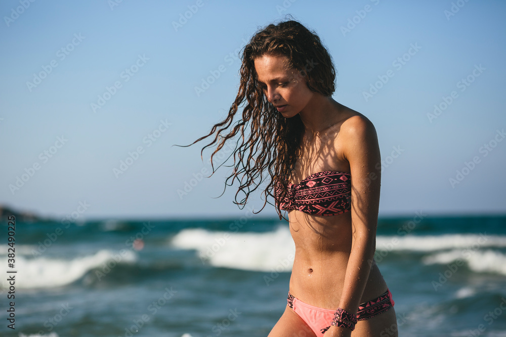 Beatiful woman enjoying the water, by the sea Beatiful woman enjoying the water, by the sea