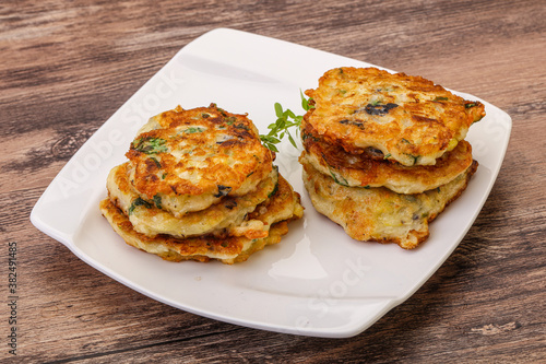 Zucchini pancakes with herbs and spices © Andrei Starostin