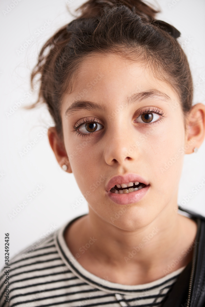 Headshot of teen girl with open mouth looking at camera Headshot of teen girl with open mouth looking at camera