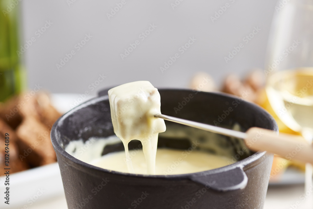 Swiss fondue with rye crouton on stick Swiss fondue with rye crouton on stick